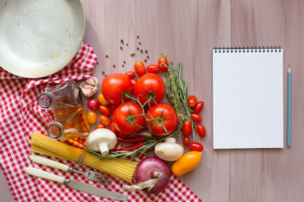Stół z różnorodnymi składnikami i przyborami kuchennymi